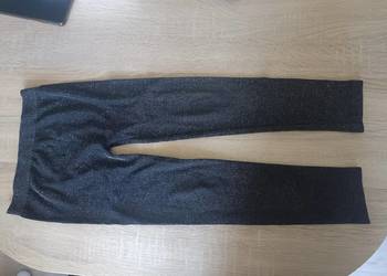 Błyszczące legginsy Primark roz. 116