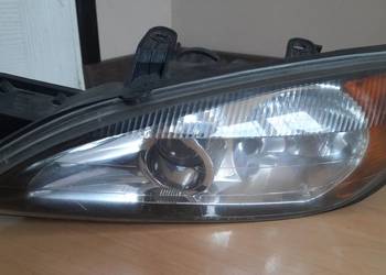 Nissan Primera P11 reflektor lampa przednia lewa EU P11.144 lift