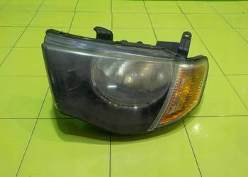 MITSUBISHI L200 IV 2.5 DID 06r 5D lampa lewa przod