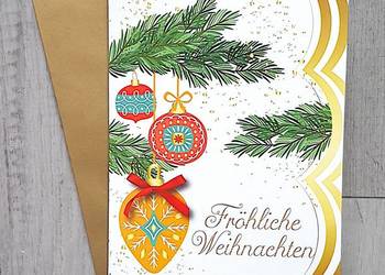 Kartka grająca bożonarodzeniowe z muzyką z kopertą Wesołych Świąt.