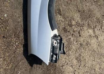 Blotnik przod lewy opel corsa c srebrny