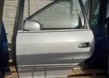 Kia CArens II  drzwi lewe przednie komplet 2 szt kolor
