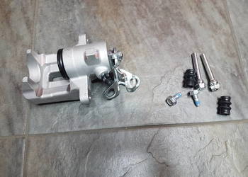 VW GOLF V TOURAN ZACISK HAMULCOWY TYL 1K0615424A 1K0615423A