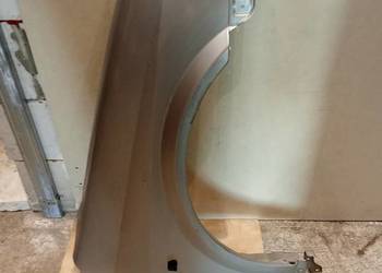 Nissan Primera P12/błotnik prawy orginał kod.lak.KYO