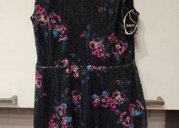 Sukienka imprezowo - koktajlowa w całośći z cekinów .