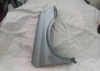 NISSAN PRIMERA P12 BŁOTNIK PRZÓD PRAWY B22 SREBRNY