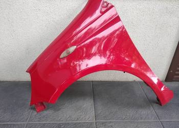 Toyota Yaris I 1 błotnik przednie lewy kierowcy oryginał czerwony 3P0