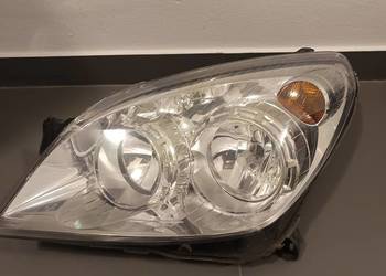 Lampa przednia lewa reflektor Opel Astra H 3 III polift GM Hella oryginalna