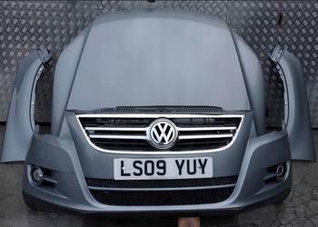 BŁOTNIK LEWY VW TIGUAN 07-16 LAK: LR7N