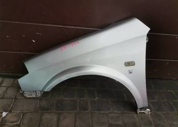 NISSAN PRIMERA P12 BŁOTNIK LEWY PRZEDNI KY0G
