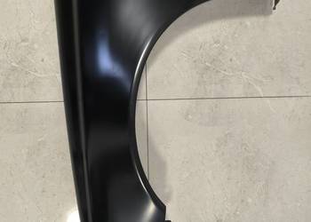 Błotnik Volvo V40 LEWY Przedlift