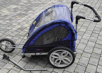 Riksza do roweru dla dwójki dzieci.