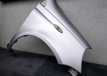 Toyota Yaris I 1 LIFT FL błotnik prawy pasażera srebrny 1E7