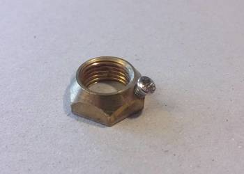 Nakrętka M10x1 do lamp ze śrubką blokującą