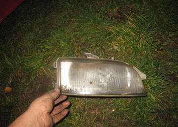 Lampa przednia prawa H4 Fiat Punto I 93-99 uszkodzona na klosz