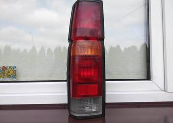 Nissan Navara D21 King Cab lampa tył tylna lewa oprawki oryginał Koito