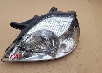 KIA RIO I LIFT  LEWY REFLEKTOR LAMPA LEWA PRZOD // 1381