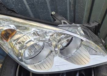 reflektor prawy astra h.oryg OEM .praKtycznie nowy z 21r.SREBRNY