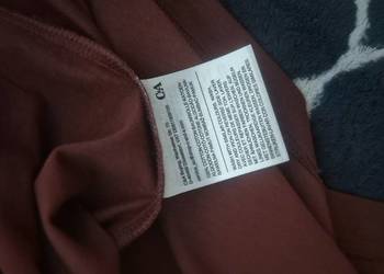 Sprzedam koszule w bardzo dobrym stanie, koloru brązowego. Rozmiar użyteczn