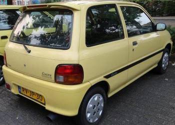 Szyba boczna drzwi błotników tylnych tył Daihatsu Cuore III 93-99 3 drzwi