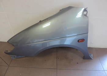 BŁOTNIK LEWY PRZEDNI RENAULT SCENIC 1