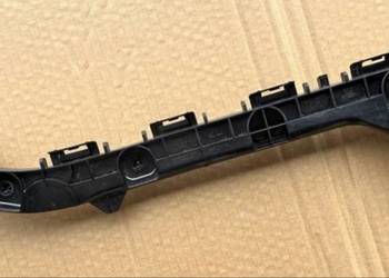 TOYOTA COROLLA E21 KOMBI ŚLIZG MOCOWANIE ZDERZAKA LEWY TYŁ 52576-02201