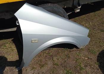 błotnik prawy nissan primera P12 KLO G