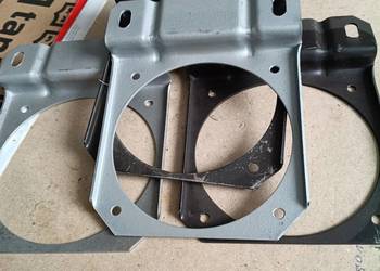 Wspornik lamp przednich C385 .