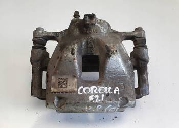 Toyota Corolla XII E21 PRZEDNI ZACISK HAMULCOWY prawy przód PASAŻERA