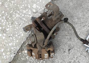 HONDA JAZZ II ZACISK LEWY  TYL 06R