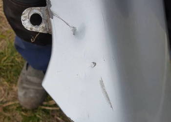 Błotnik lewy toyota e12 kod lakieru 199