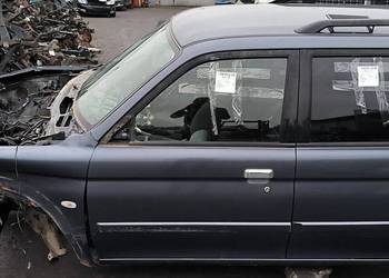 DRZWI LEWE PRZÓD MITSHUBISHI MONTERO