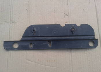 13287641 Mocowanie ślizg dolny lampy zderzaka lewy Opel Astra J IV 09-12