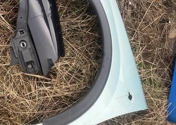 Blotnik lewy opel corsa c zielony