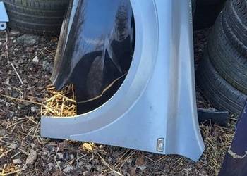 Błotnik Lewy Opel Astra H Srebrny  ładny stan