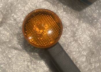 Nowy Oryginalny Kierunkowskaz Migacz DX PIAGGIO SI - TRIOM 210066 N270