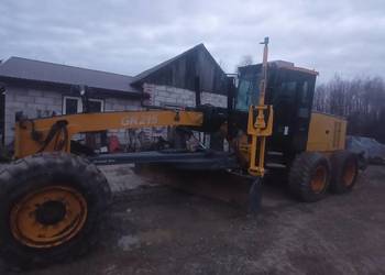 równiarka CAT O&K  HBM system na Trimble GPS Tachimetr