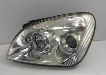 KIA CARENS III  LAMPA PRZÓD LEWA SOCZEWKA