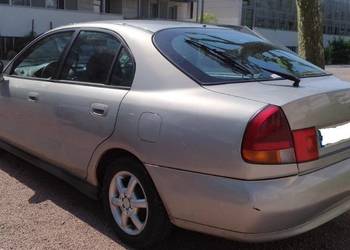 Zderzak tylny tył Mitsubishi Carisma hatchback przedlift
