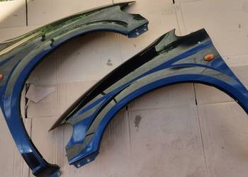 błotnik prawy lub lewy Chrysler Voyager IV " czarny " 00-07