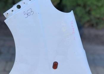 BŁOTNIK LEWY PRZÓD - OPEL VIVARO A TRAFIC II PRIMASTAR 01-14 Czarna Opona