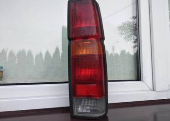 Nissan Navara D21 King Cab lampa tył tylna prawa oprawki oryginał Koito
