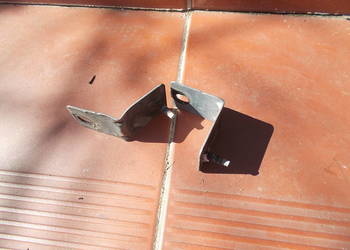 Megane II 04r wspornik mocowanie błotnika