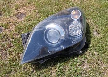 Lampa Opel Astra H III lewy przód Bi-Xenon skrętny Hella GM kompletna