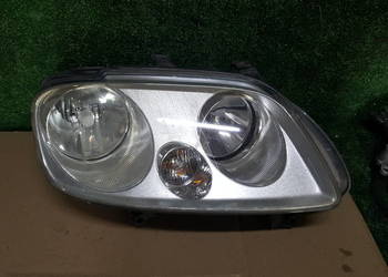 Reflektor lampa Volkswagen Caddy III Prawy