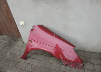 BŁOTNIK PRAWY PRZEDNI RENAULT SCENIC 1 FL NV713