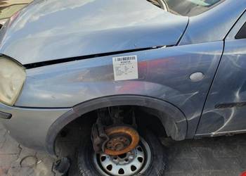 BŁOTNIK LEWY PRZÓD OPEL CORSA C L163