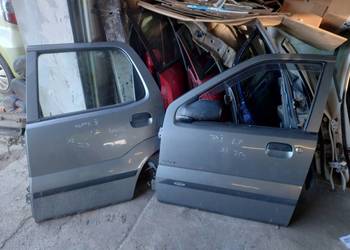 Drzwi Kpl PrzednielTylne Lewe Prawe Lak ZCD Suzuki Ignis II MH 04-07r Wysył
