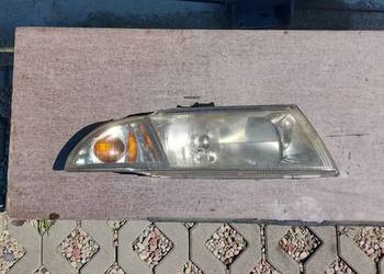 Mitsubishi carisma reflektor przedni prawy 158 578-00