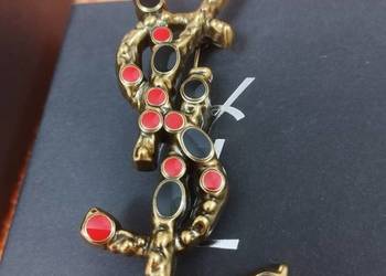 Używana broszka YSL Saint Laurent Paris w kolorze ciemnego złota z kamienia